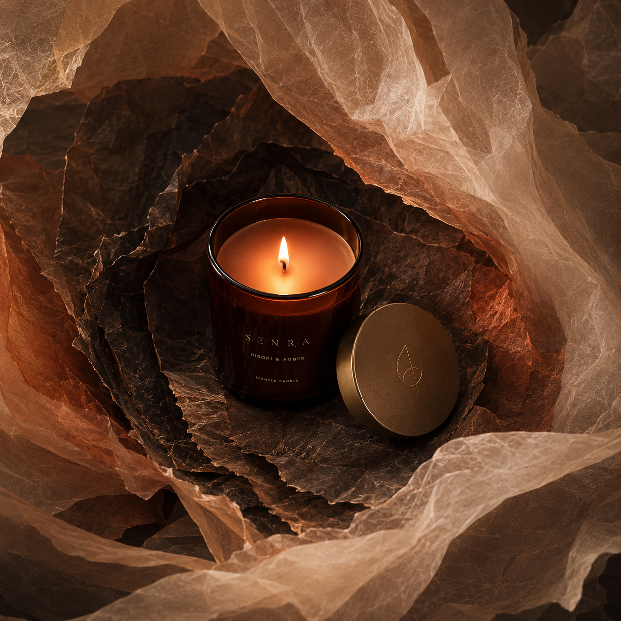 SENRA square social: the Hinoki & Amber candle seen through translucent Ember Veil layers